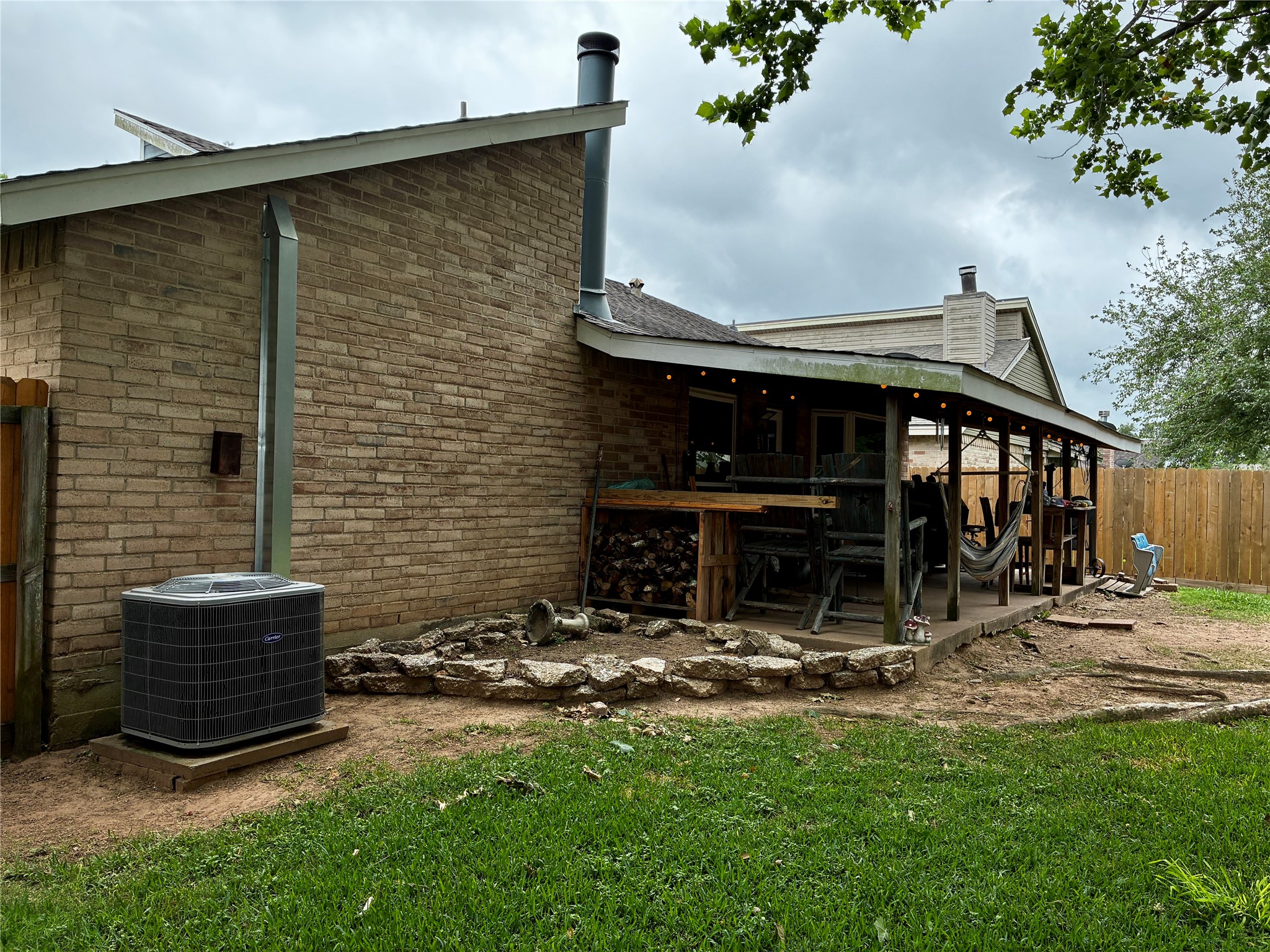 2 Sarita Road Angleton, TX 77515 - Photo 21 of 21 a backyard of a house with yard and outdoor seating
