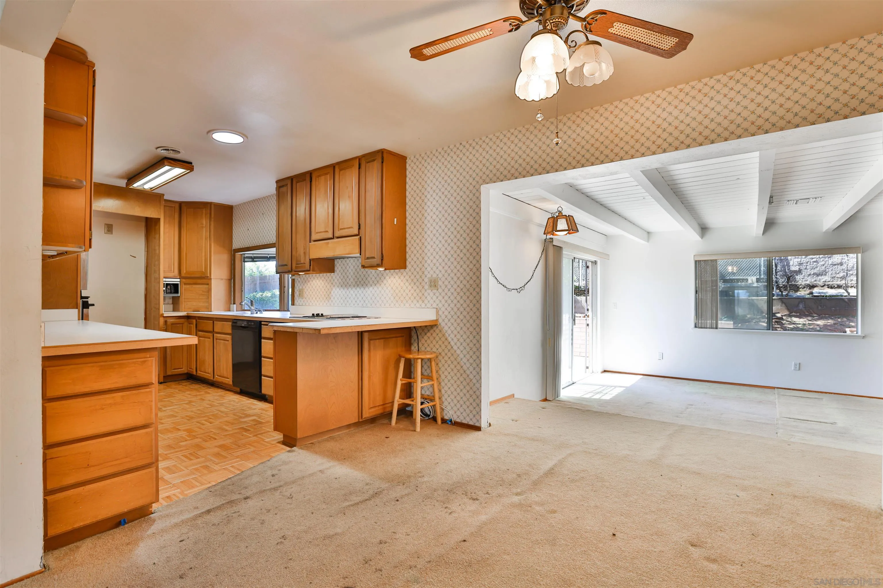 10320 Rancho Road La Mesa, CA 91941 - Photo 12 of 43 a large kitchen with stainless steel appliances granite countertop a dishwasher a stove and a refrigerator with cabinets