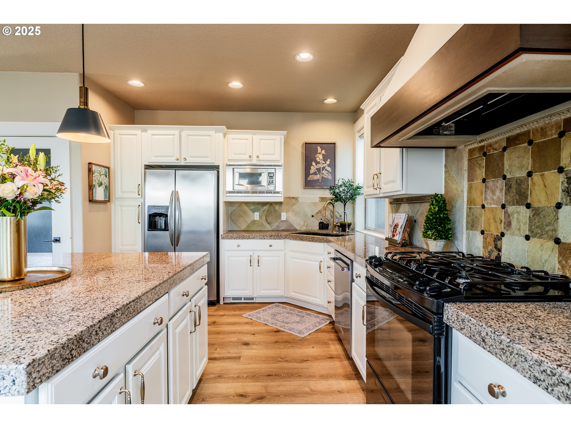 16472 Southwest 133rd Terrace Tigard, OR 97224 - Photo 14 of 48 a kitchen with stainless steel appliances granite countertop a sink stove and refrigerator