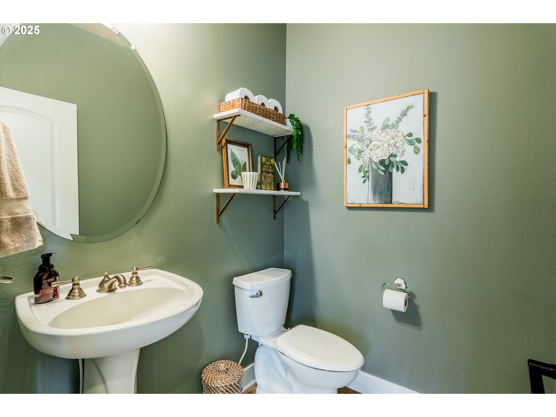 16472 Southwest 133rd Terrace Tigard, OR 97224 - Photo 17 of 48 a bathroom with a toilet sink and mirror