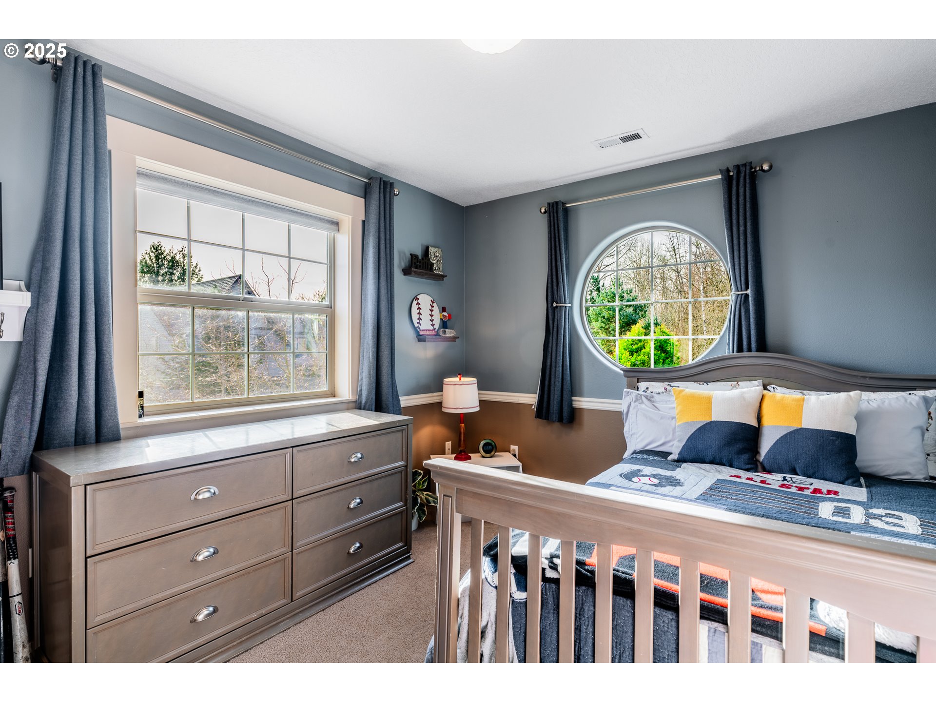 16472 Southwest 133rd Terrace Tigard, OR 97224 - Photo 23 of 48 a bedroom with a bed and a window