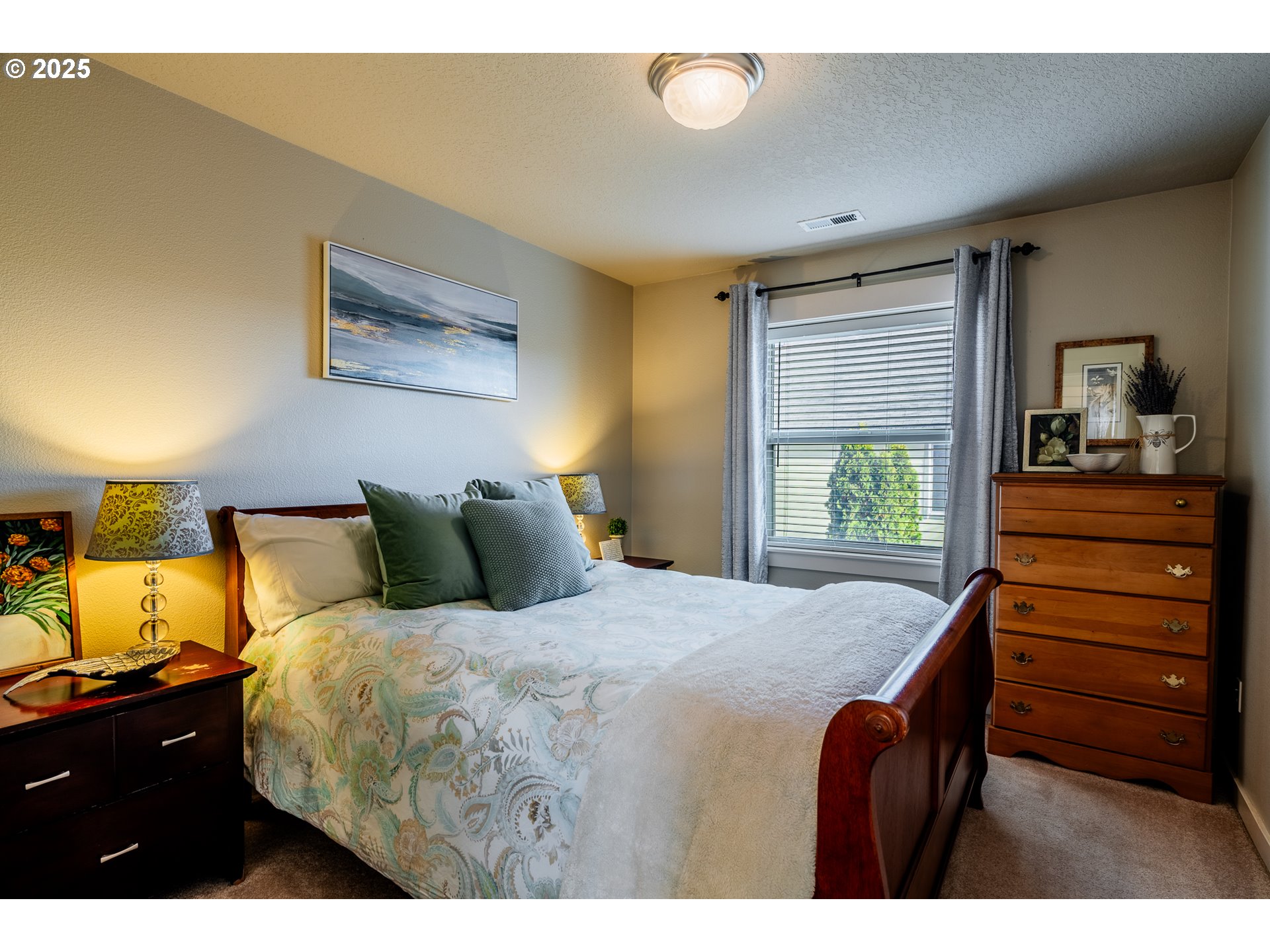 16472 Southwest 133rd Terrace Tigard, OR 97224 - Photo 24 of 48 a bedroom with a bed and a dresser
