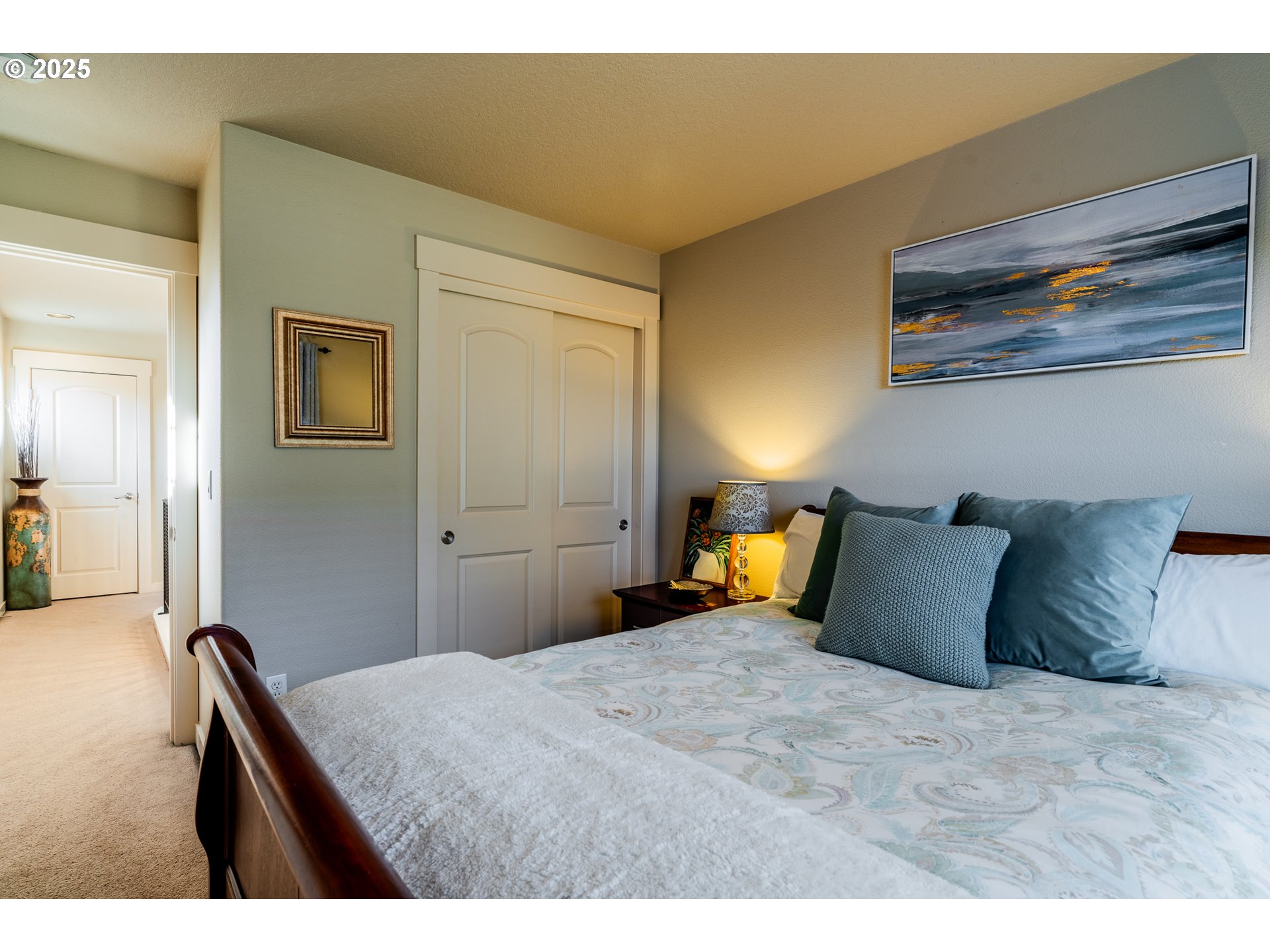 16472 Southwest 133rd Terrace Tigard, OR 97224 - Photo 25 of 48 a bedroom with a bed and wooden floor
