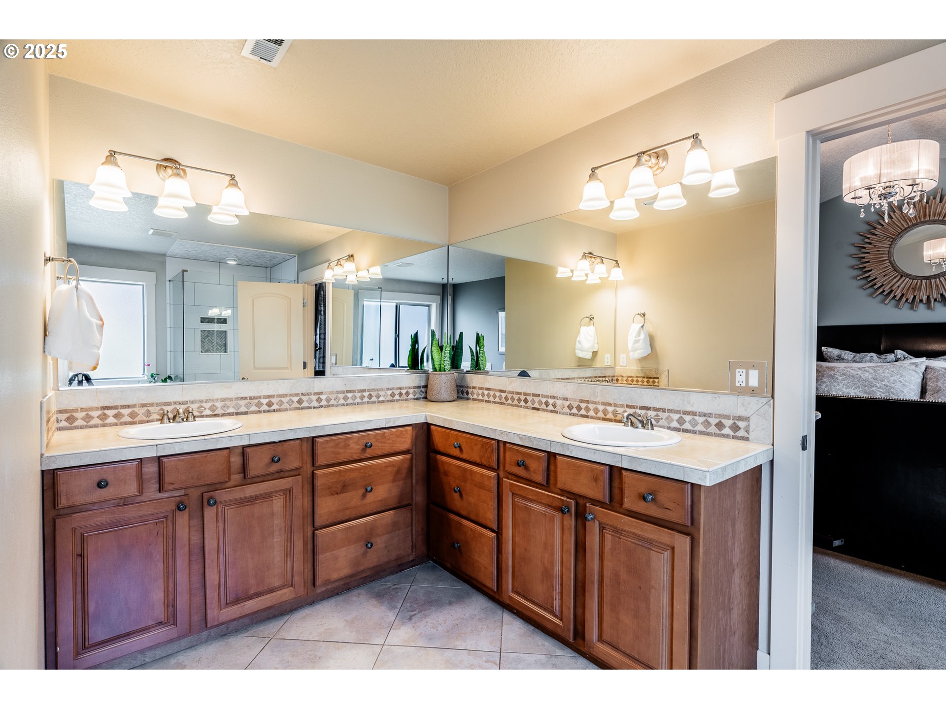 16472 Southwest 133rd Terrace Tigard, OR 97224 - Photo 29 of 48 a spacious bathroom with a sink double vanity and a mirror