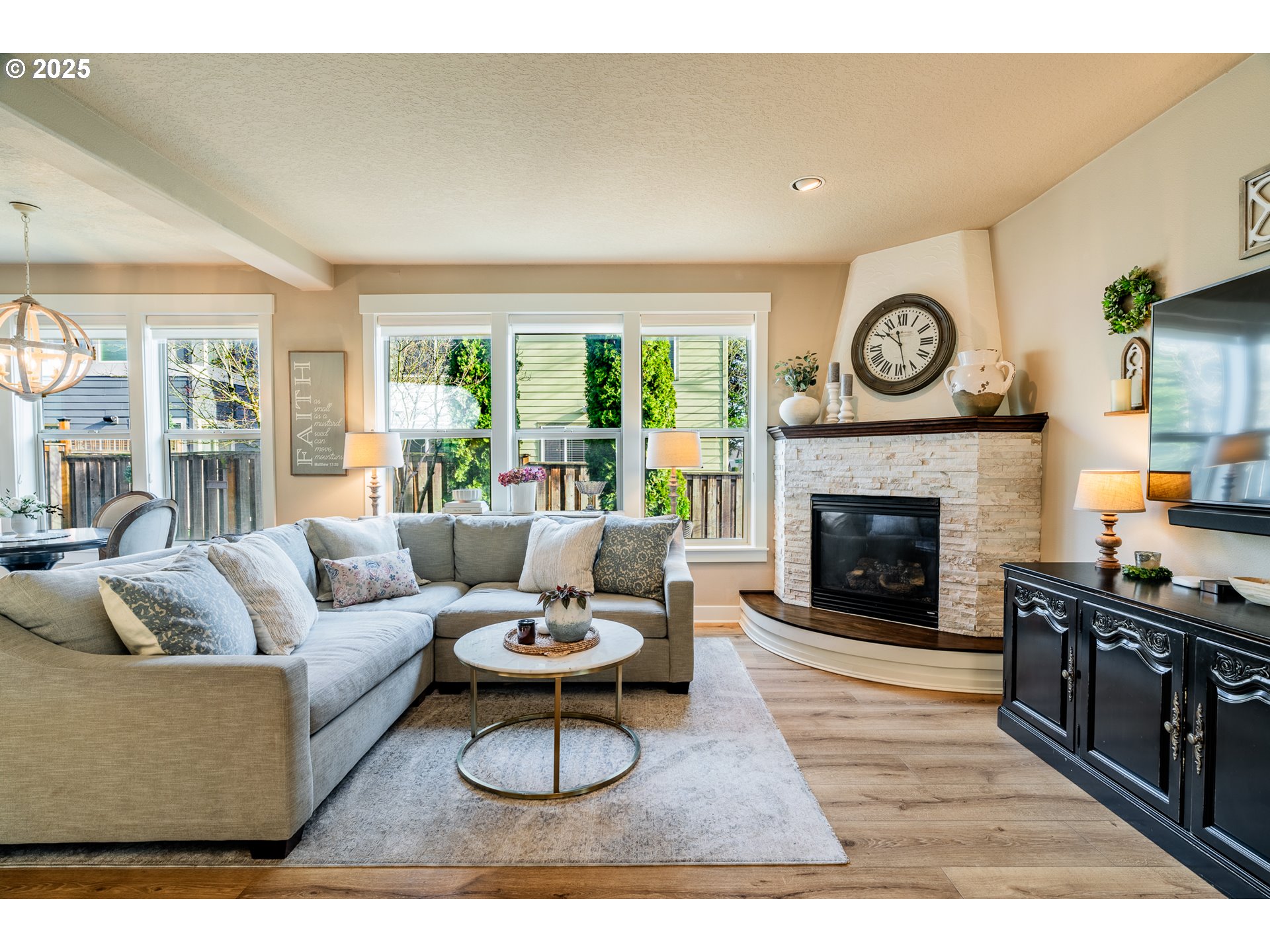 16472 Southwest 133rd Terrace Tigard, OR 97224 - Photo 3 of 48 a living room with furniture and a fireplace