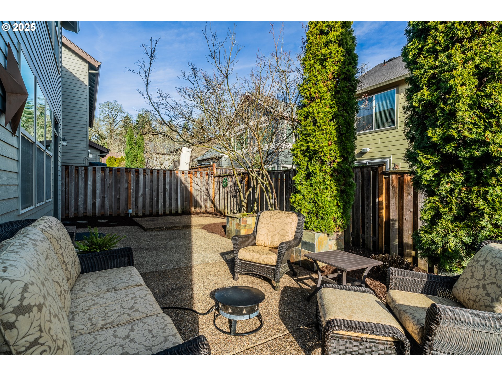 16472 Southwest 133rd Terrace Tigard, OR 97224 - Photo 33 of 48 a view of a patio with couches table and chairs and potted plants