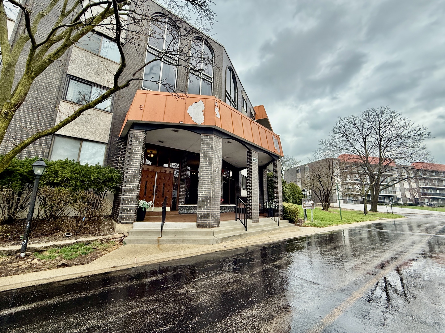 4900 Foster Street, Unit 407 Skokie, IL 60077 - Photo 2 of 3 a view of a building with a pathway