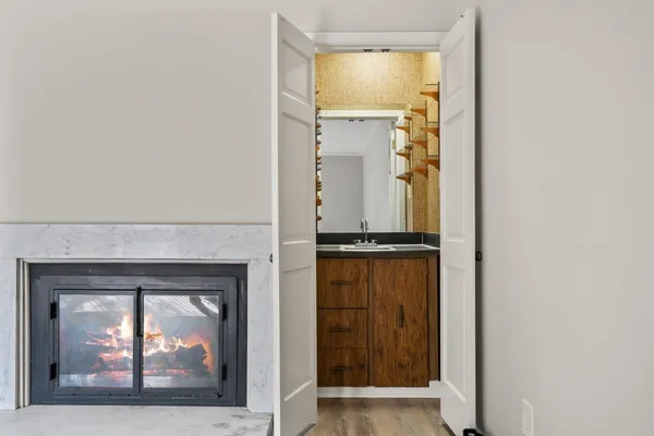 a view of a living room with a fireplace