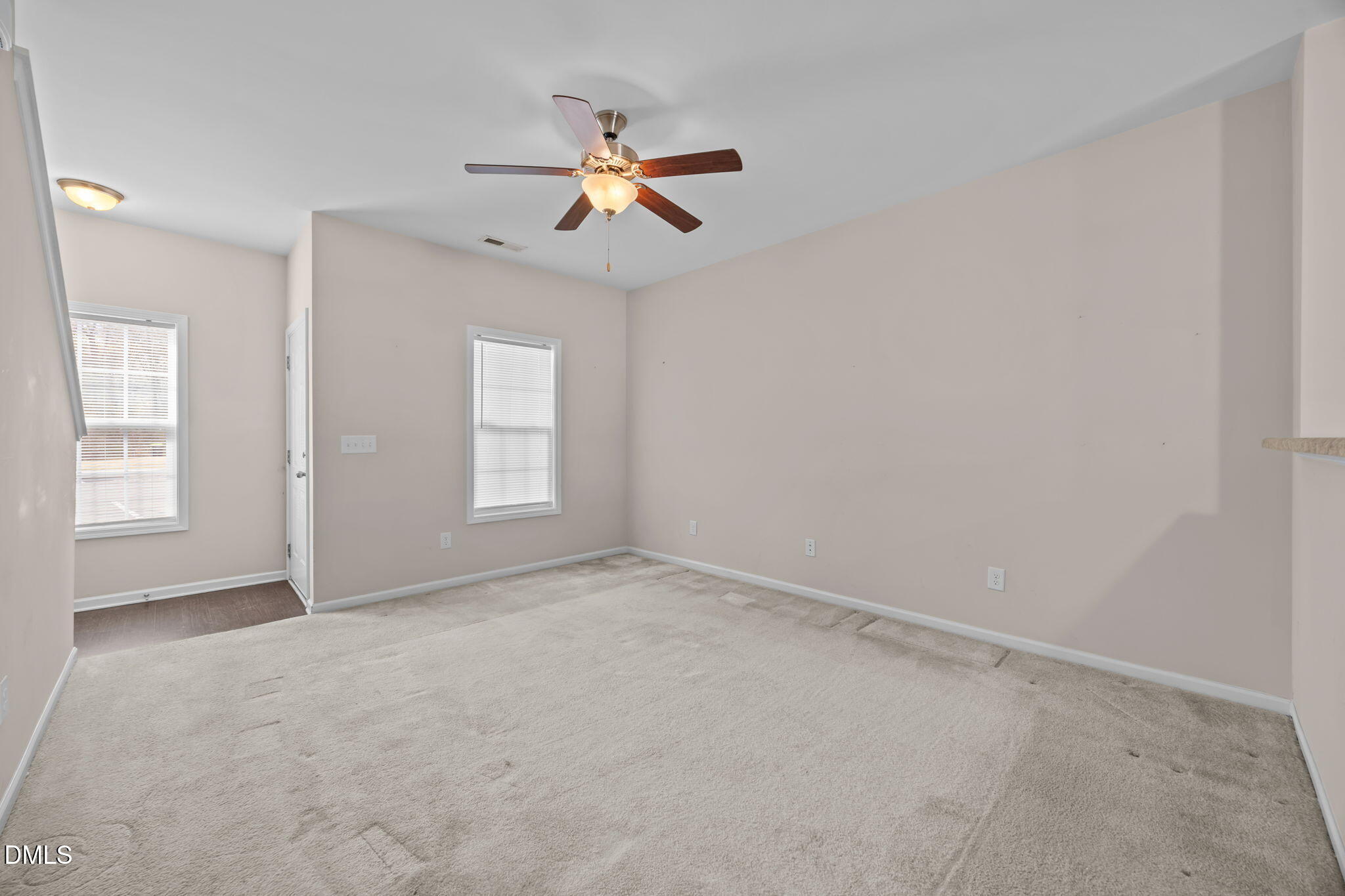 504 Winston Way Creedmoor, NC 27522 - Photo 17 of 45 an empty room with windows and fan