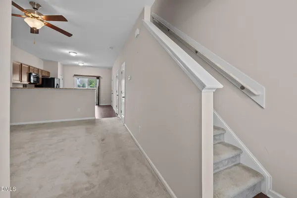 a view of a hallway with workspace and entryway