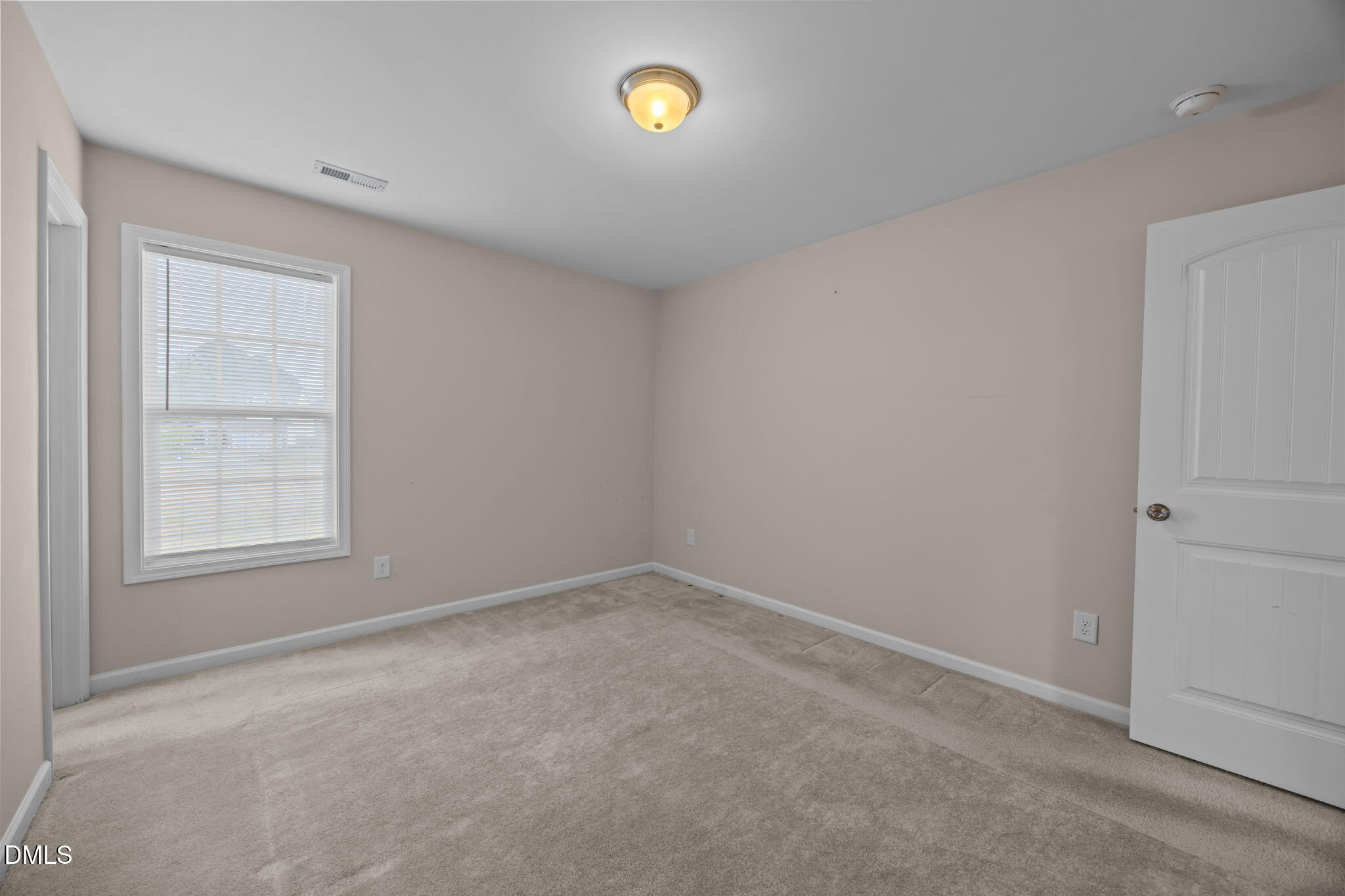 504 Winston Way Creedmoor, NC 27522 - Photo 31 of 45 an empty room with windows