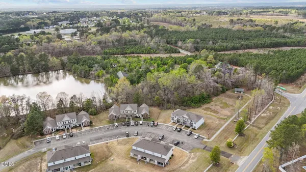 an aerial view of a house with a yard