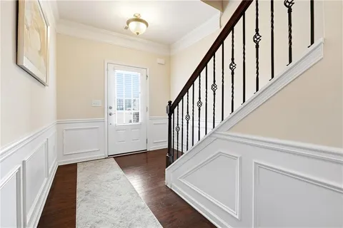 a view of an entryway with wooden floor