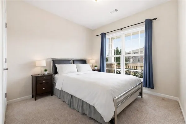 a bedroom with a bed and window