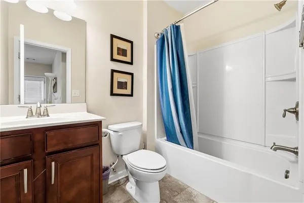 a bathroom with a sink toilet and vanity