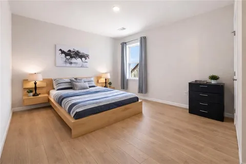 a bedroom with a bed and a closet