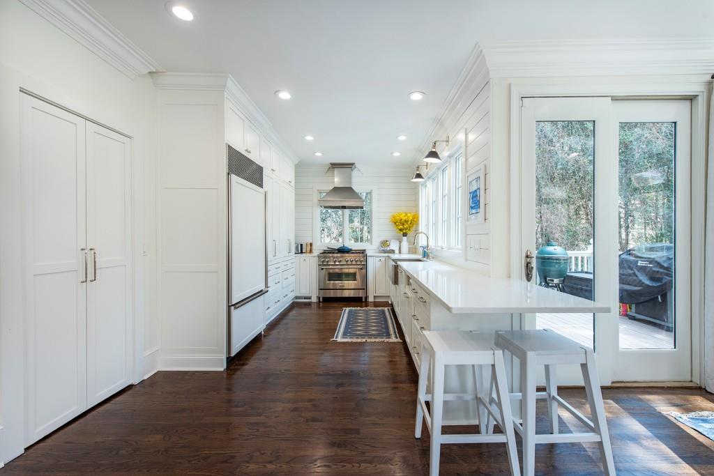 3211 Circle Oaks Drive Southeast Atlanta, GA 30339 - Photo 14 of 50 a kitchen with a table chairs refrigerator and cabinets