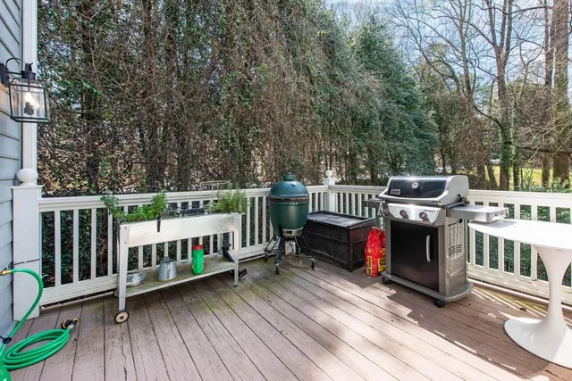 a view of a deck and a yard with furniture