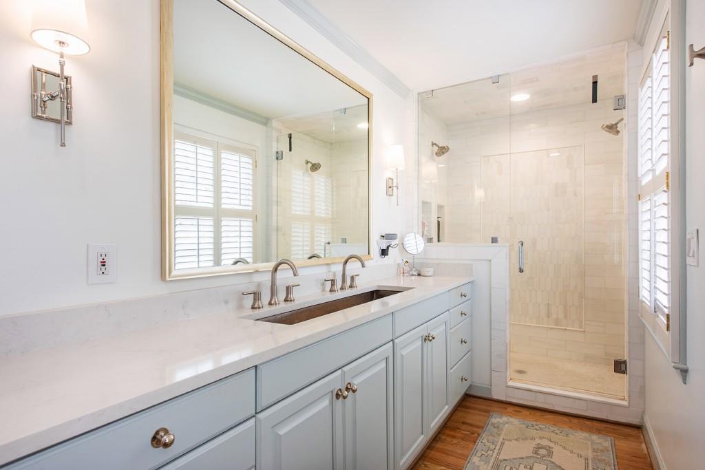 3211 Circle Oaks Drive Southeast Atlanta, GA 30339 - Photo 28 of 50 a bathroom with double vanity and a mirror