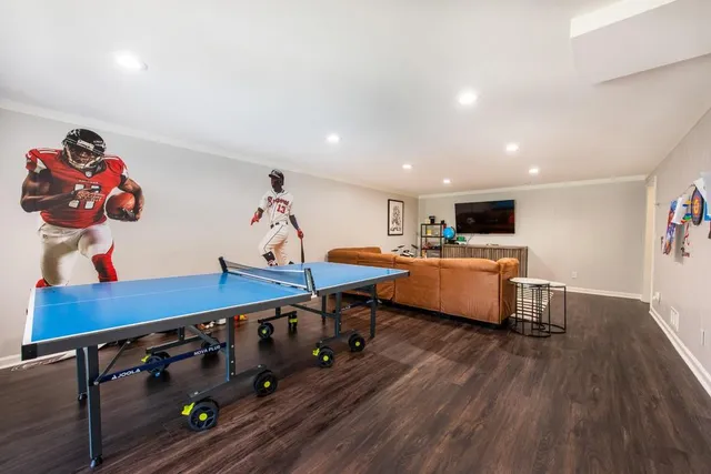 a living room with furniture and wooden floor