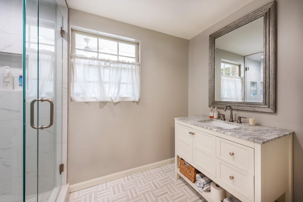 3211 Circle Oaks Drive Southeast Atlanta, GA 30339 - Photo 40 of 50 a bathroom with a granite countertop sink and a mirror