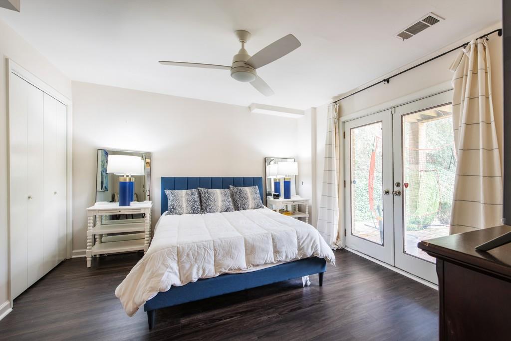 3211 Circle Oaks Drive Southeast Atlanta, GA 30339 - Photo 42 of 50 a bedroom with a bed and wooden floor
