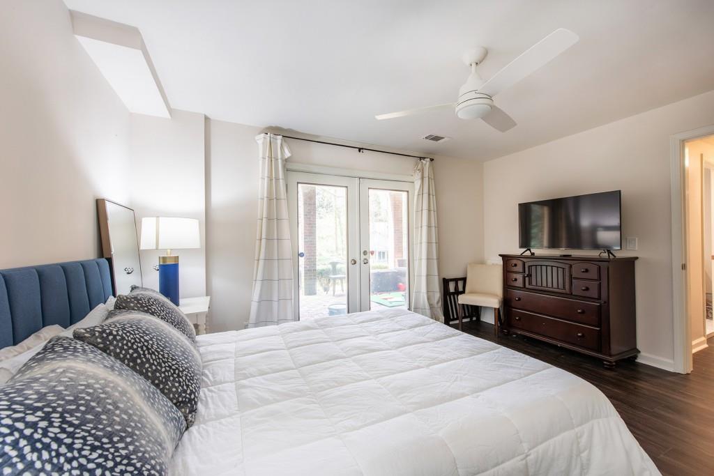 3211 Circle Oaks Drive Southeast Atlanta, GA 30339 - Photo 43 of 50 a bedroom with a bed and a flat screen tv