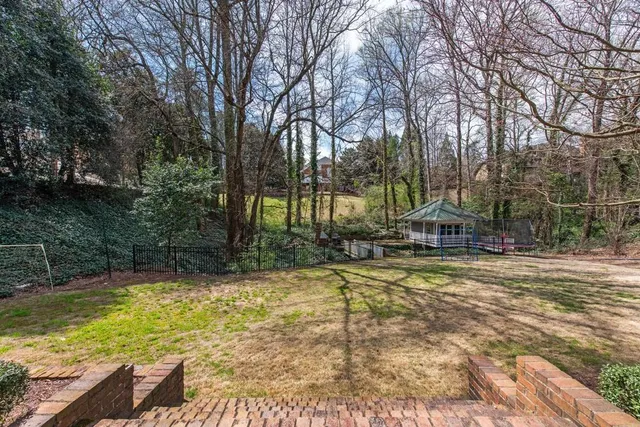 a view of a swimming pool with a patio