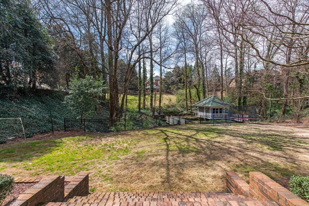 3211 Circle Oaks Drive Southeast Atlanta, GA 30339 - Photo 48 of 50 a view of a swimming pool with a patio
