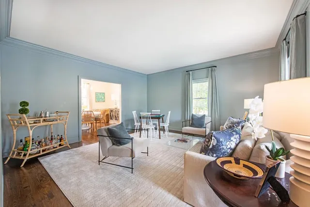 a living room with furniture and a table