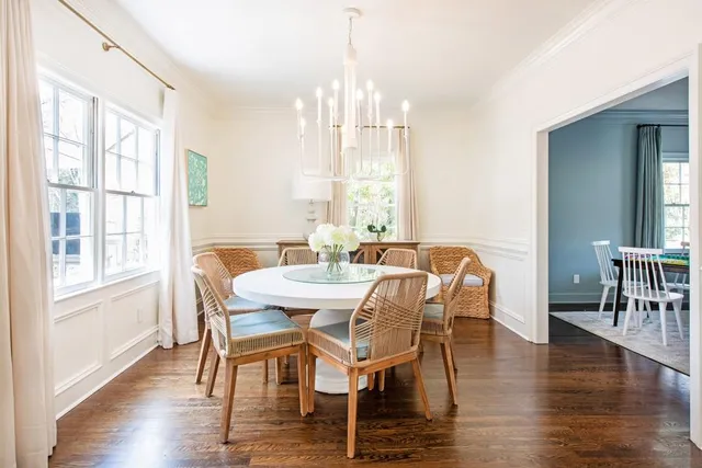 a view of a dining room with furniture window and wooden floor