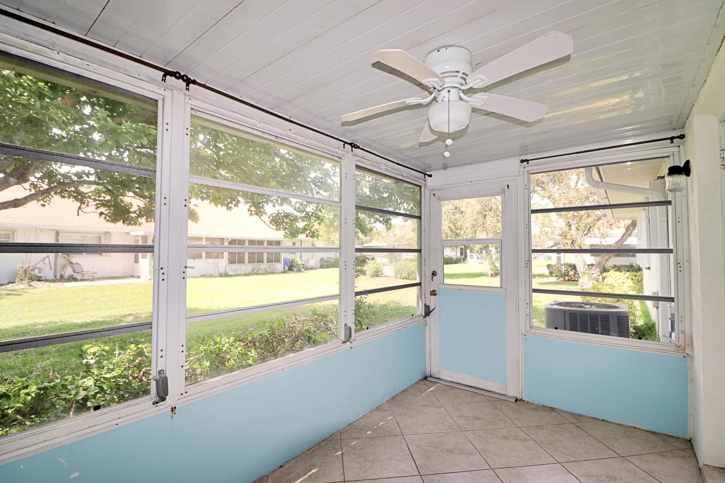 831 Timberview Drive, Unit C Fort Pierce, FL 34982 - Photo 16 of 18 a view of an entryway with a large window