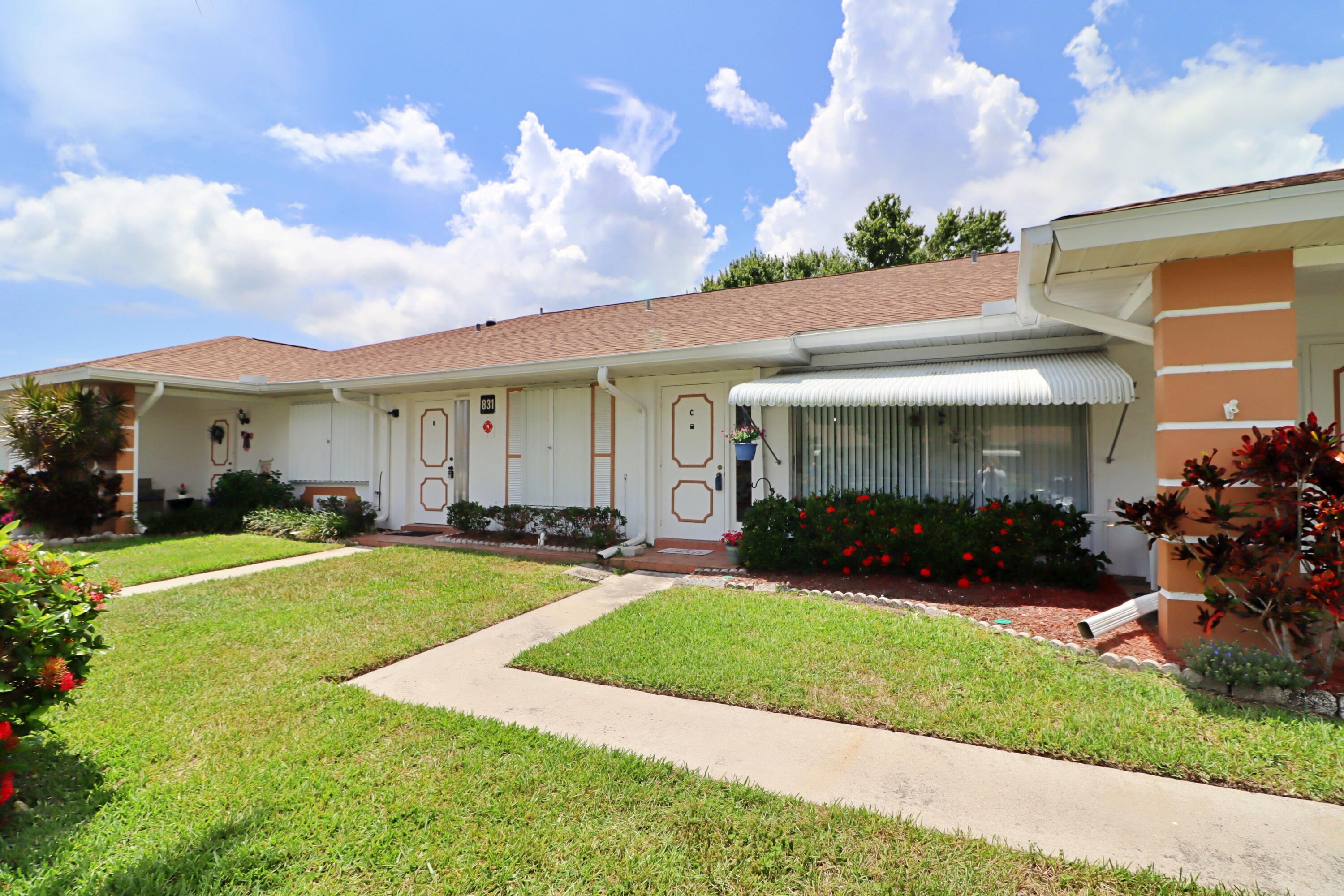 831 Timberview Drive, Unit C Fort Pierce, FL 34982 - Photo 2 of 18 a view of a yard in front of house