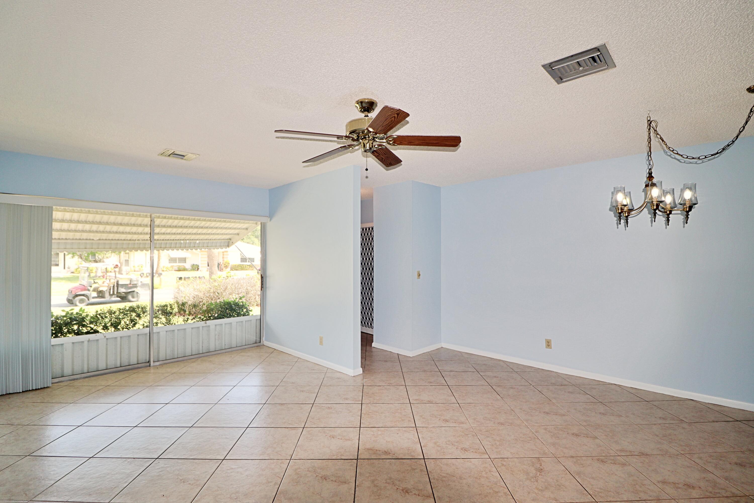 831 Timberview Drive, Unit C Fort Pierce, FL 34982 - Photo 3 of 18 a view of an empty room with a window