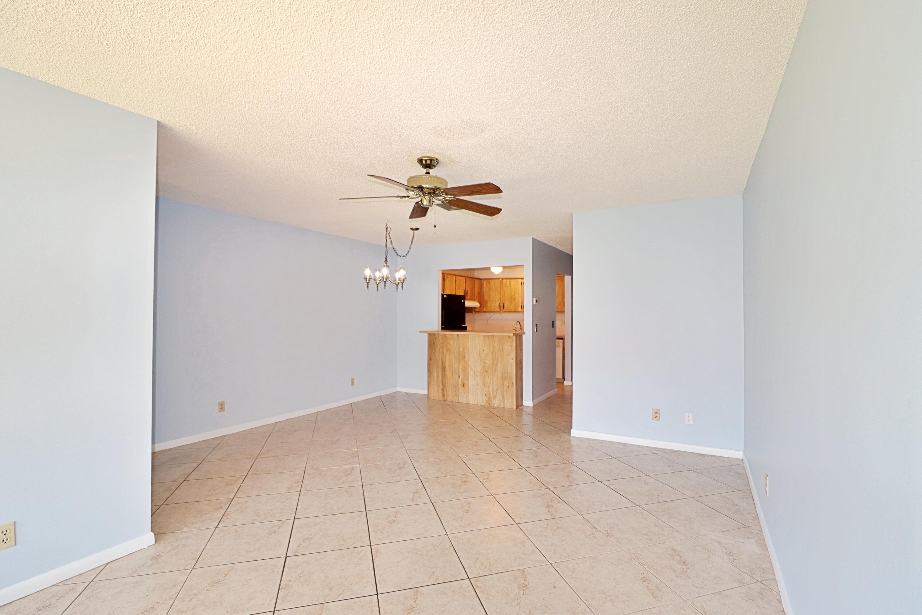 831 Timberview Drive, Unit C Fort Pierce, FL 34982 - Photo 5 of 18 a view of a room with a sink and cabinets