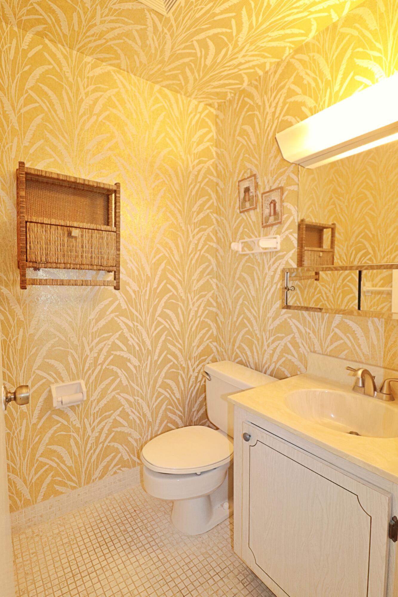 831 Timberview Drive, Unit C Fort Pierce, FL 34982 - Photo 9 of 18 a bathroom with a toilet and a sink