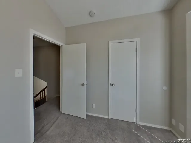 a view of hallway with closet
