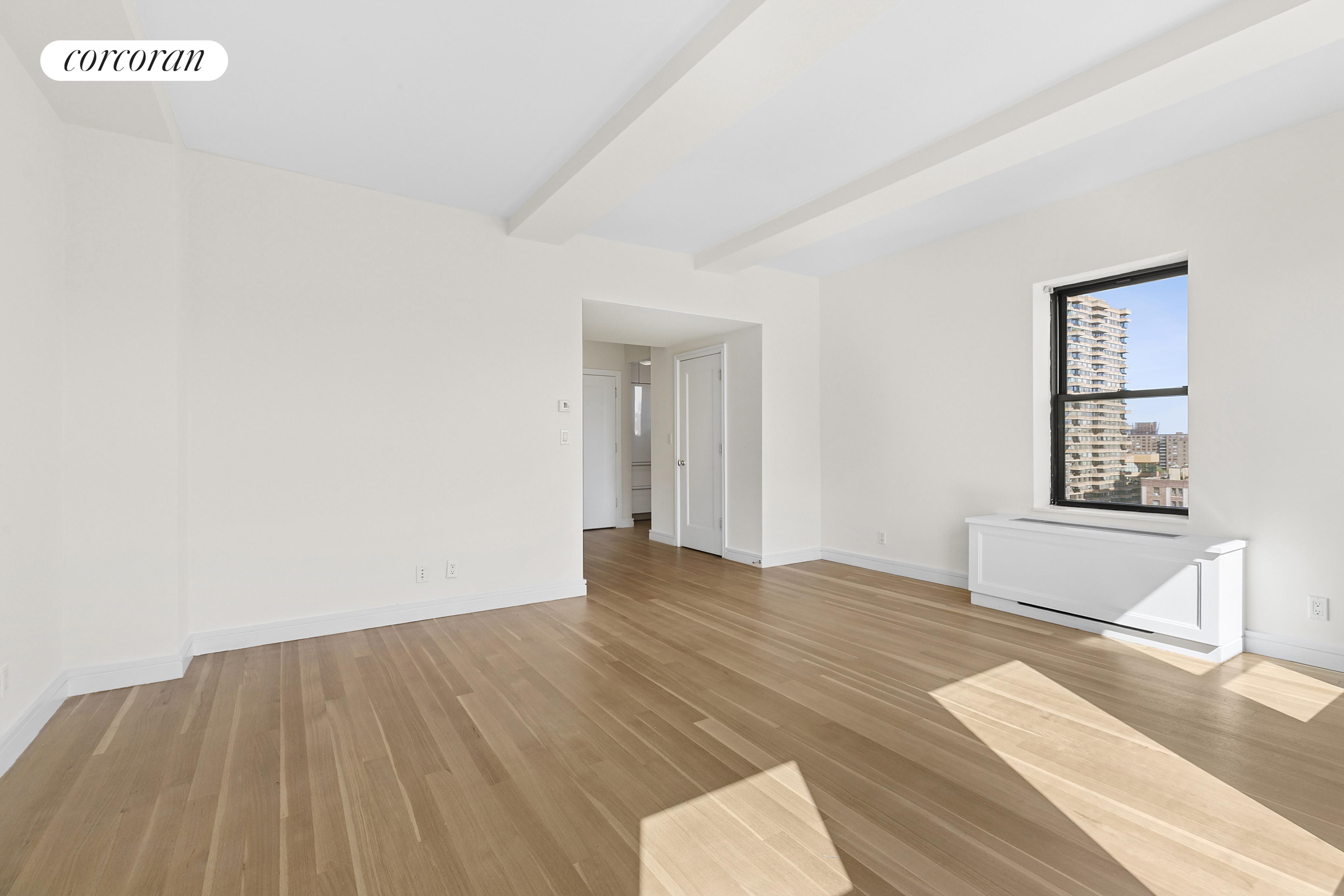 230 Riverside Drive, Unit 19L Manhattan, NY 10025 - Photo 12 of 18 a view of an empty room and window