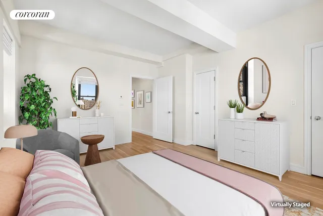 a bedroom with a large bed and a window