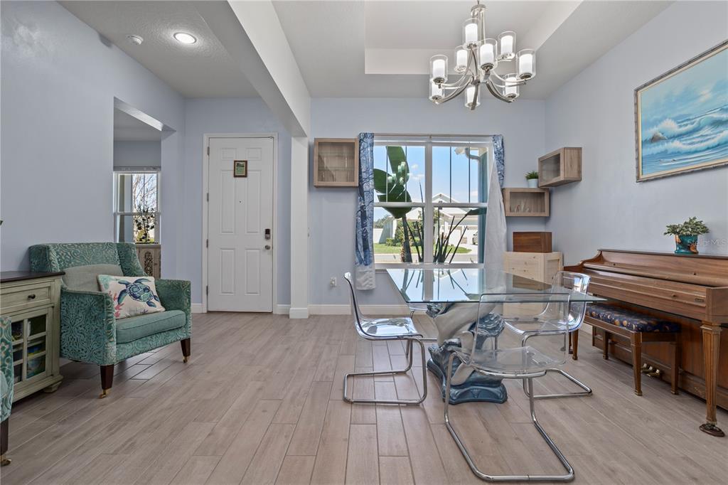 493 Nowell Loop DeLand, FL 32724 - Photo 13 of 33 a living room with patio bathtub and wooden floor