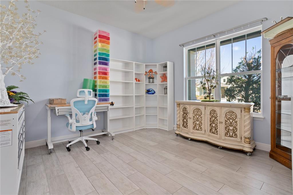 493 Nowell Loop DeLand, FL 32724 - Photo 16 of 33 a view of a workspace with furniture and a window