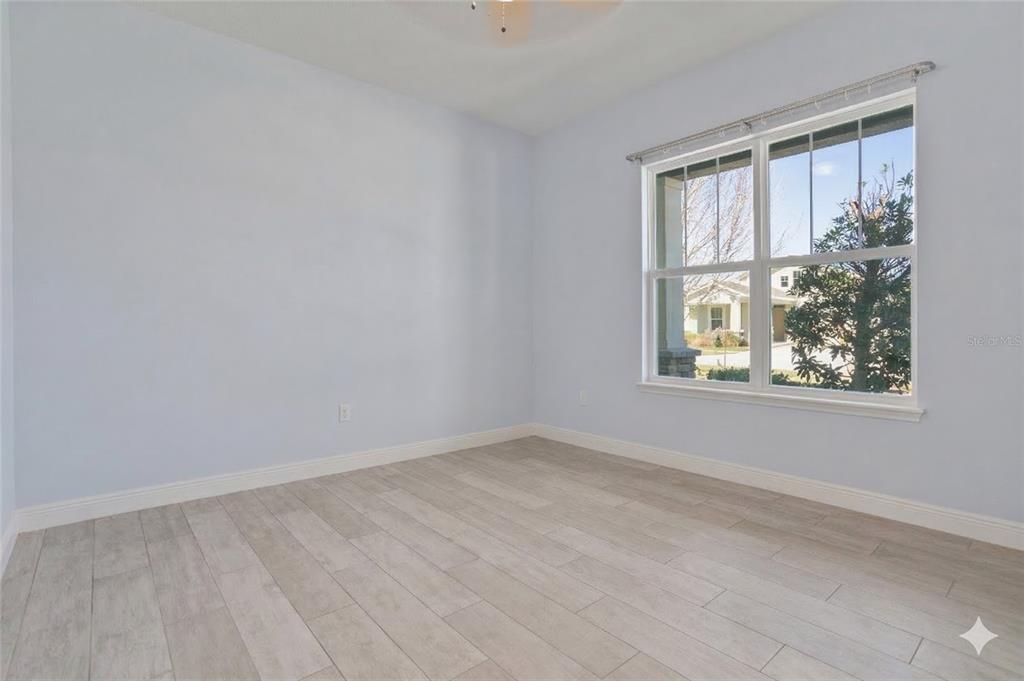 493 Nowell Loop DeLand, FL 32724 - Photo 17 of 33 an empty room with windows
