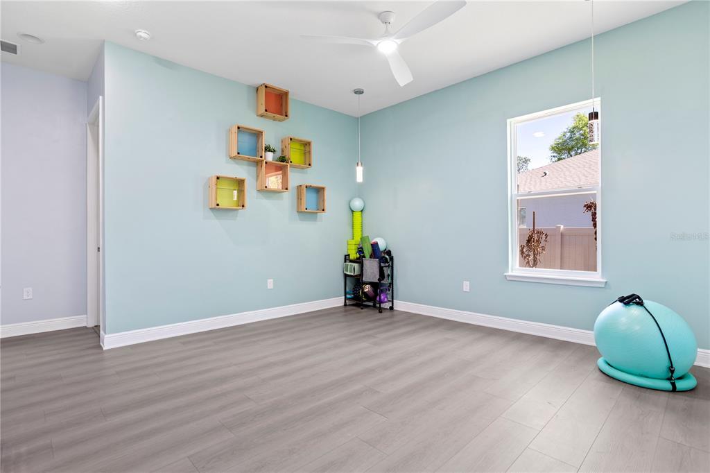 493 Nowell Loop DeLand, FL 32724 - Photo 18 of 33 a view of livingroom with furniture and wooden floor