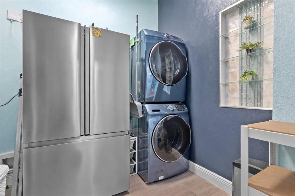 493 Nowell Loop DeLand, FL 32724 - Photo 25 of 33 a room with a washer and dryer