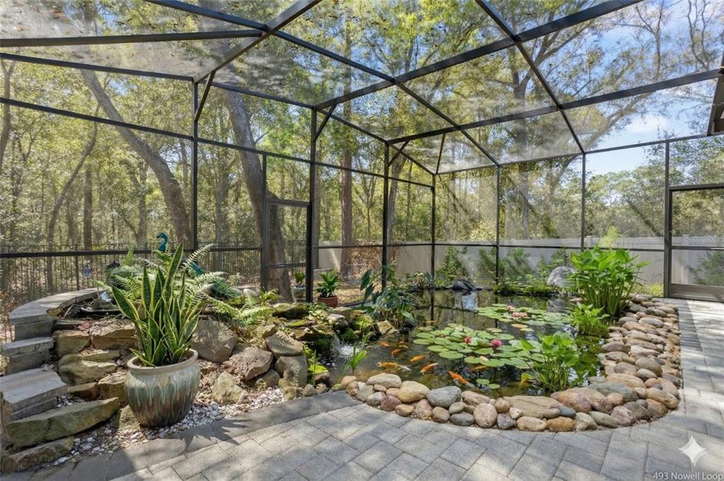 493 Nowell Loop DeLand, FL 32724 - Photo 28 of 33 a view of a garden