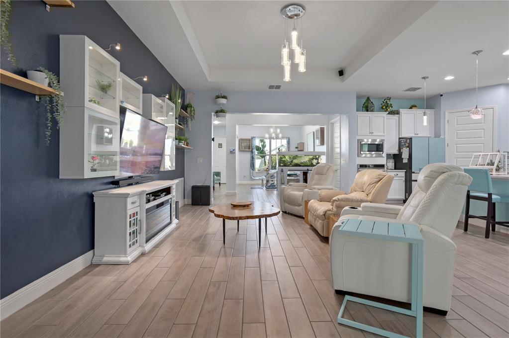 493 Nowell Loop DeLand, FL 32724 - Photo 7 of 33 a living room with furniture and a wooden floor