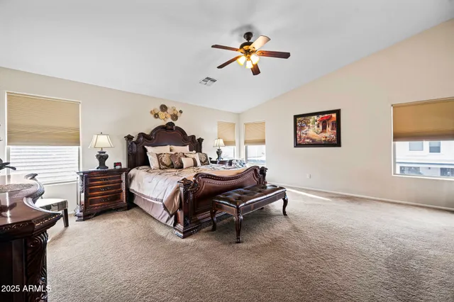 a bedroom with a bed furniture and a window