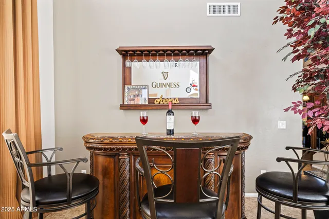 a view of a dining room with furniture and chandelier