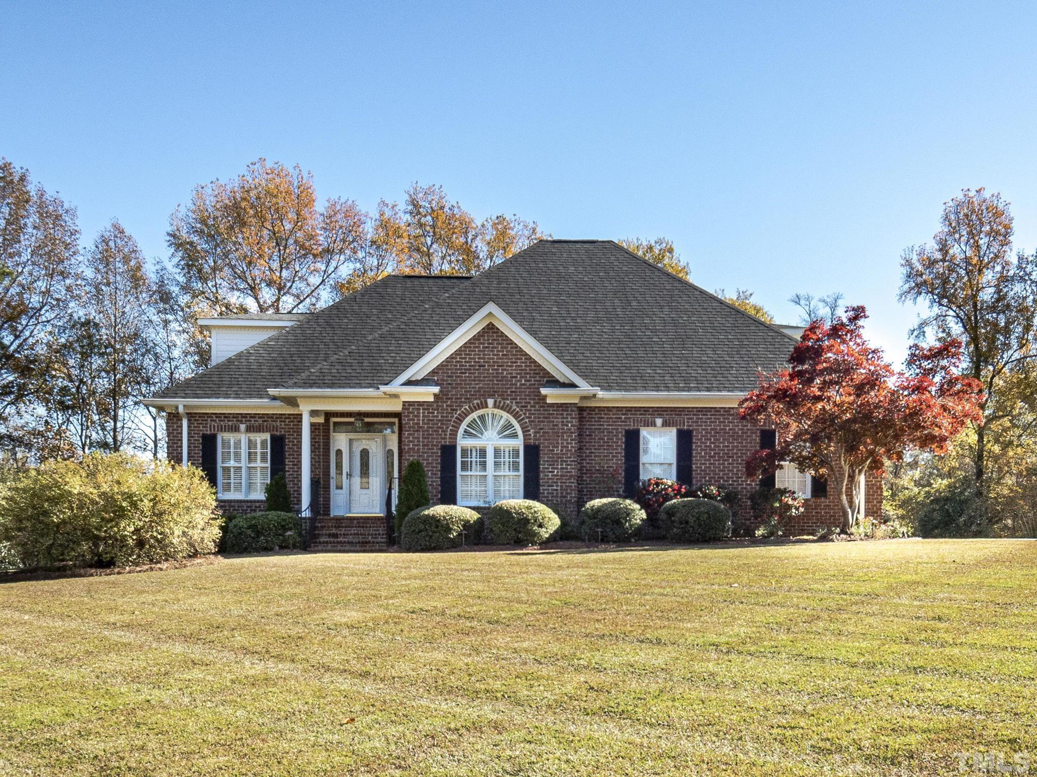 726 Pope Lake Road Angier, NC 27501 - Photo 1 of 29 a front view of house with yard and trees around