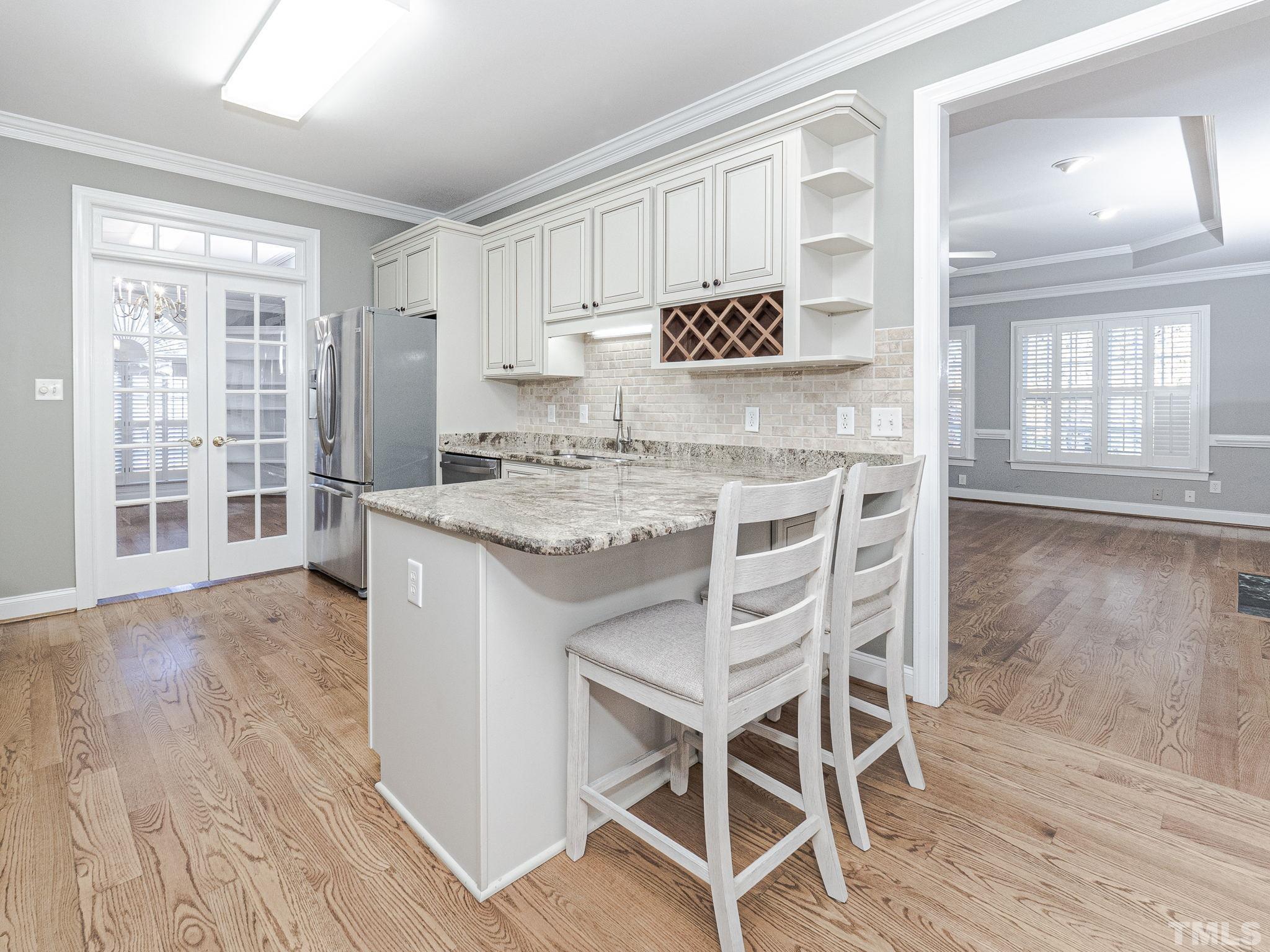 726 Pope Lake Road Angier, NC 27501 - Photo 12 of 29 a kitchen with a table and chairs in it